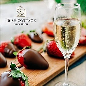 Glass of champagne and a plate of chocolate covered strawberries